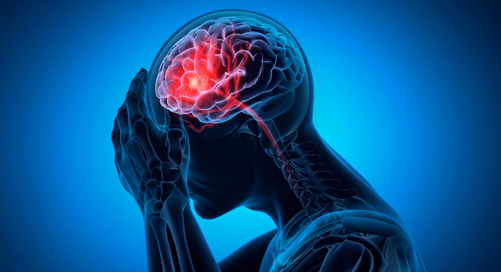 An image of a person whose brain is highlighted for illustrating a traumatic brain injury.