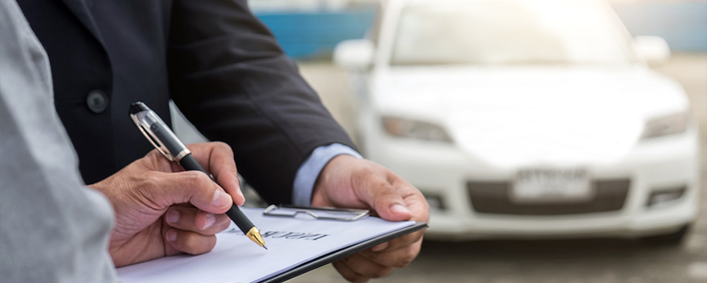 Person reviewing insurance claim documents after a motor vehicle accident in New York.